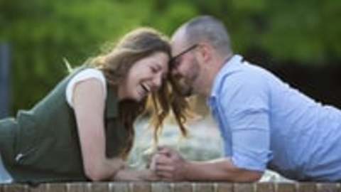 Wife Surprises Husband With A Baby Announcement During Photo Shoot