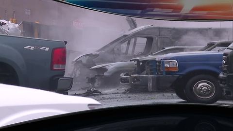 Cars destroyed by fallen power lines at auto dealership in Warren