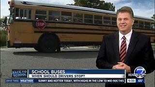 When should you stop for a school bus?