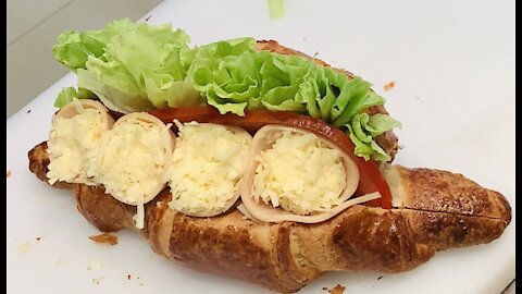 Making of turkey croissant sandwich