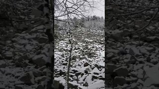 goant snowy rock wall.