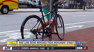 After a debate between drivers and cyclists, the city plans to remove the E. Monument St bike lanes