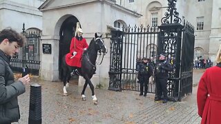 kings guard from Buckingham Palace salutes the kings guard from the house hold cavalry #london