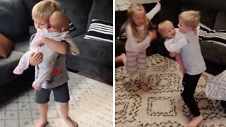 Big brother dances with his sister since she was a baby