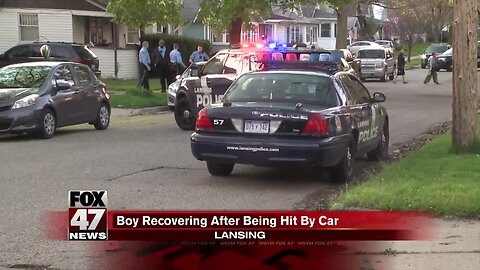 Police: Boy hospitalized after being hit by car in Lansing