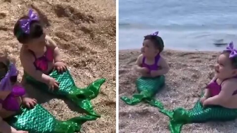 Two Baby mermaid enjoying the day near the beach