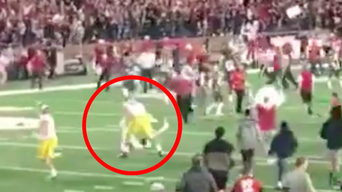 USC Player in Full Gear Completely LEVELS Washington State Fan for Rushing the Field