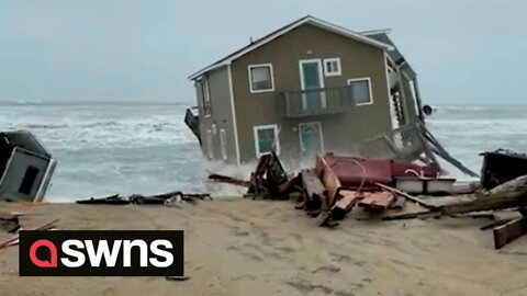 Dramatic video shows the moment an oceanside house valued at $381,200 is swept out to sea in storm