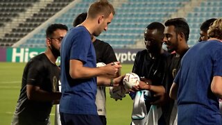 England squad welcome migrant workers to training camp in Qatar