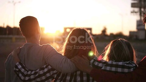 Group of friends walking embracing and having fun together in city