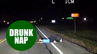 Dashcam reveals moment police discover an "intoxicated" woman taking a nap - in the road