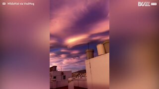 Lenticular clouds and sunset create surreal landscape