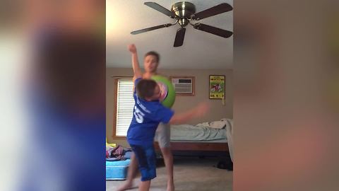 Boy Bounces Off The Ball And Falls To The Floor