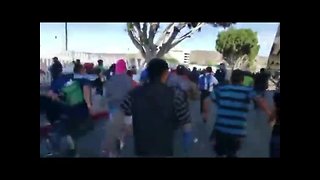 Video shows migrants running toward border