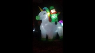 Leprechaun riding a unicorn