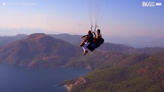 Cellist hits high notes with amazing paragliding performance in the sky