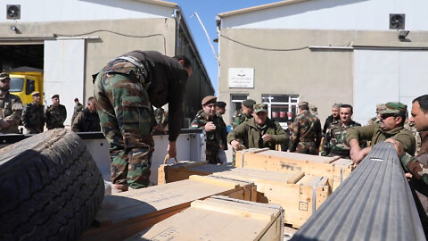 Coalition advisors attend ammunition distribution