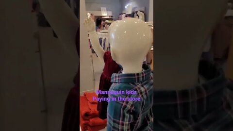 Mannequin kidsPaying in the store