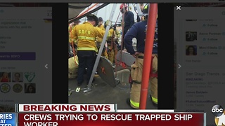 Crews trying to rescue trapped ship worker