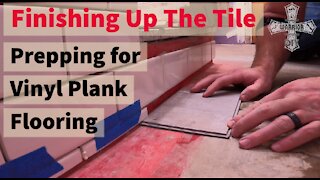 Finishing up the tile-vinyl plank flooring with tile wall DIY