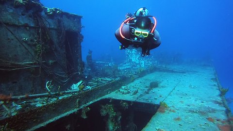 Divers explore the ghostly wreck of Russian destroyer gunship #356