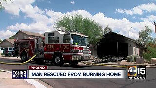 Valley man rescued from burning home