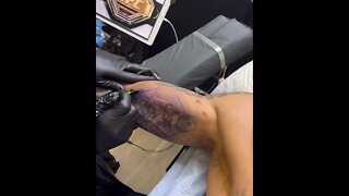 Alex “Poatan” Pereira gets the UFC belt tattooed on his arm