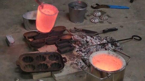 Melting aluminum cans with my furnace from Amazon. Using cast iron muffin molds