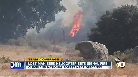 Lost man sees helicopter, sets signal fire
