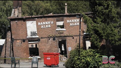 Police arrest two men in suspected torching of British pub known for its lopsided walls
