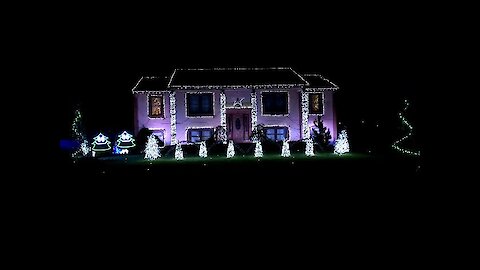 Christmas light display set to epic dance mix