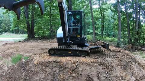 Compacting & grading remote campsite in the woods w/bobcat e42 R2 series mini excavator