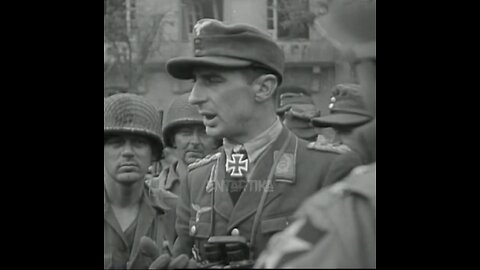 ww2 footage of captured afrika korps talking to us soldiers in normandy france.