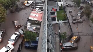 Extreme flooding in Ecuador's capital sweeps cars away