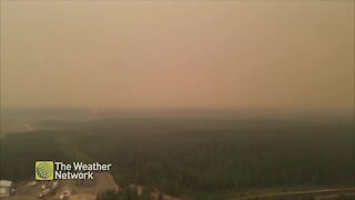 Smoky conditions darken the sky over Manitoba