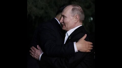Xi gripped Putin by the shoulders and hugged him