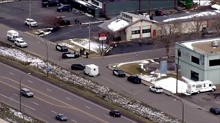 Lakewood officer injured in shootout with postal worker robbers, police say