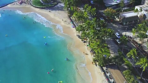 Drone Footage Of A Beach Near City Buildings