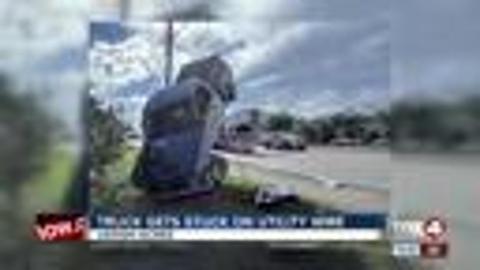 Truck lands on front wheels, utility wire