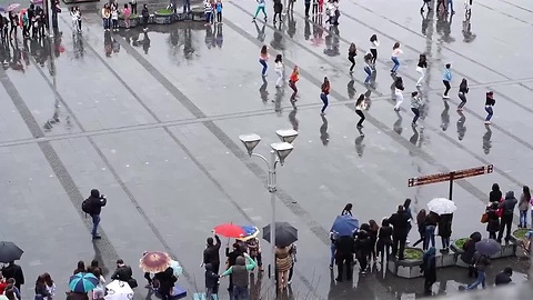 Flash mob marriage proposal at public square