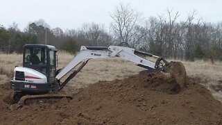 Duck Pond, land management Bobcat excavator work.