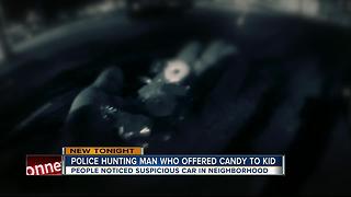 Police search for man who offered candy to child