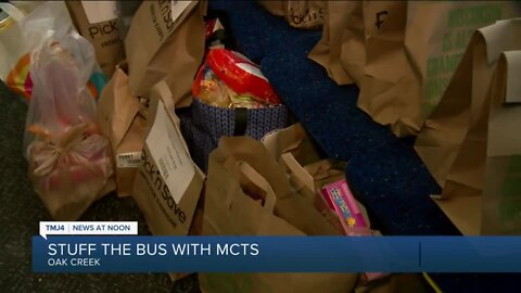 Busses packed with food during Stuff the Bus event