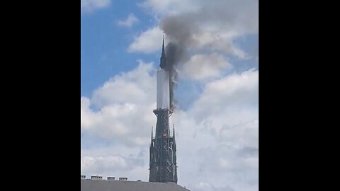 Spire Of Famous French Cathedral On Fire