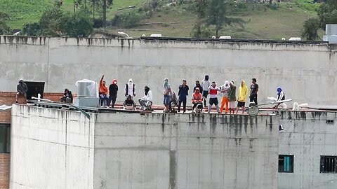 Inmates on roof of Ecuador prison as police officers held hostage inside