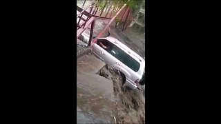 Impatient Driver gets swept away by flood waters.