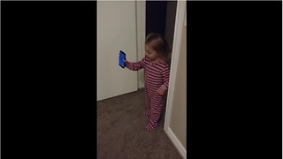 Little girl "shows" grandpa new home during phone call