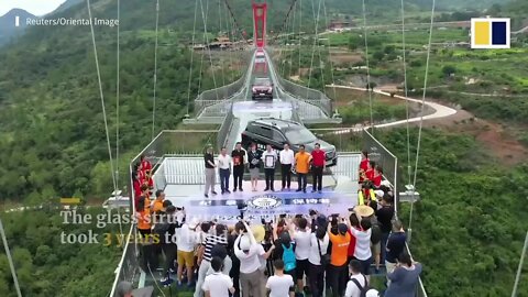 New glass bridge thrills visitors with walk over 526 metre 1, 725ft wide span in southern China