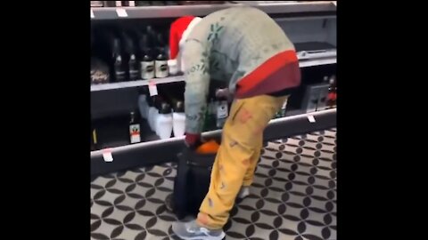 Ugly Sweater Shoplifter Stocks Up On Vodka For The Christmas Weekend