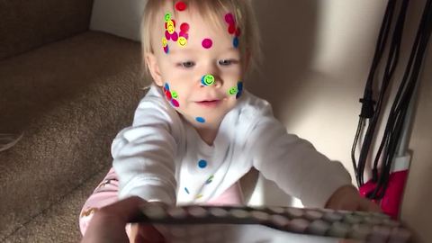 Little Girl Puts Stickers On Everything, Even On The Dog!